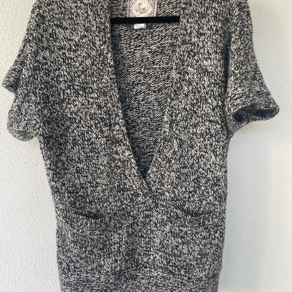 Cable short sleeve sweater/vest style.